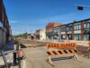 Stettler Residents Encouraged To Visit Businesses Impacted By Construction Street under construction with orange barriers reading 'ROAD CLOSED' and a closed curbside area on a sunny day in a commercial district.