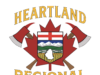 Heartland Regional Fire Issues Fire Advisory For County of Stettler Heartland Regional Fire Department emblem featuring a shield with mountains and fields, crossed axes, and a gold-edged banner reading Heartland above.