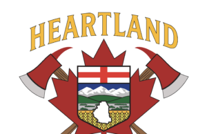 Heartland Regional Fire Issues Fire Advisory For County of Stettler Heartland Regional Fire Department emblem featuring a shield with mountains and fields, crossed axes, and a gold-edged banner reading Heartland above.