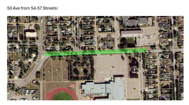 Aerial map showing 50 Ave highlighted in bright green between 54 St and 57 St, with surrounding houses, a large parking lot, and a running track area nearby.