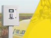 Stettler County Expands Diesel Storage To Prevent Fleet Delays Fuel-lock security cabinet with keypad mounted on a post beside a field, with a yellow tinted overlay on the right.