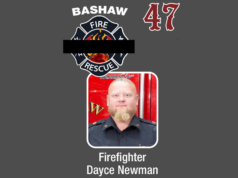 Bashaw Fire Department Mourns Loss of Volunteer Firefighter & Son Portrait of a firefighter in uniform beneath a fire department badge, with a gray background and the word 'Firefighter' shown below.