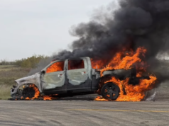 Heartland Regional Fire Extinguishes Highway 835 Vehicle Blaze A burned pickup truck on a rural road engulfed in bright orange flames with thick black smoke.