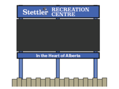 Town of Stettler Awards $68K Contract For New Recreation Centre Digital Sign Outdoor sign for Stettler Recreation Centre, with a blue header and posts, showing the slogan 'In the Heart of Alberta' on a wooden fence backdrop.