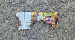‘Sounded Like Gunshots’: Fireworks Dropped From Vehicle Hit Stettler Neighbourhood Burnt fireworks wrapper with a Jackpot slot-machine graphic on a rocky, gravel surface.