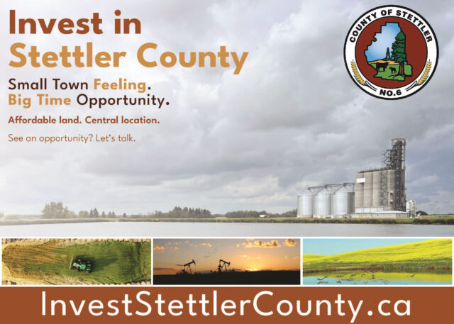 Promotional banner: 'Invest in Stettler County' with a county seal on the right, showing industrial silos and a cloudy sky in the background.