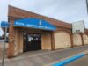 Stettler Legion Requests Town Council Grant Writing Help For Roof, HVAC Repairs Brick building storefront with a blue curved sign reading 'ROYAL CANADIAN LEGION BRANCH No. 59' above the entrance.