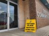 How to Vote In The 2026 Alberta Referendum Exterior view of a brick community hall with a bright yellow